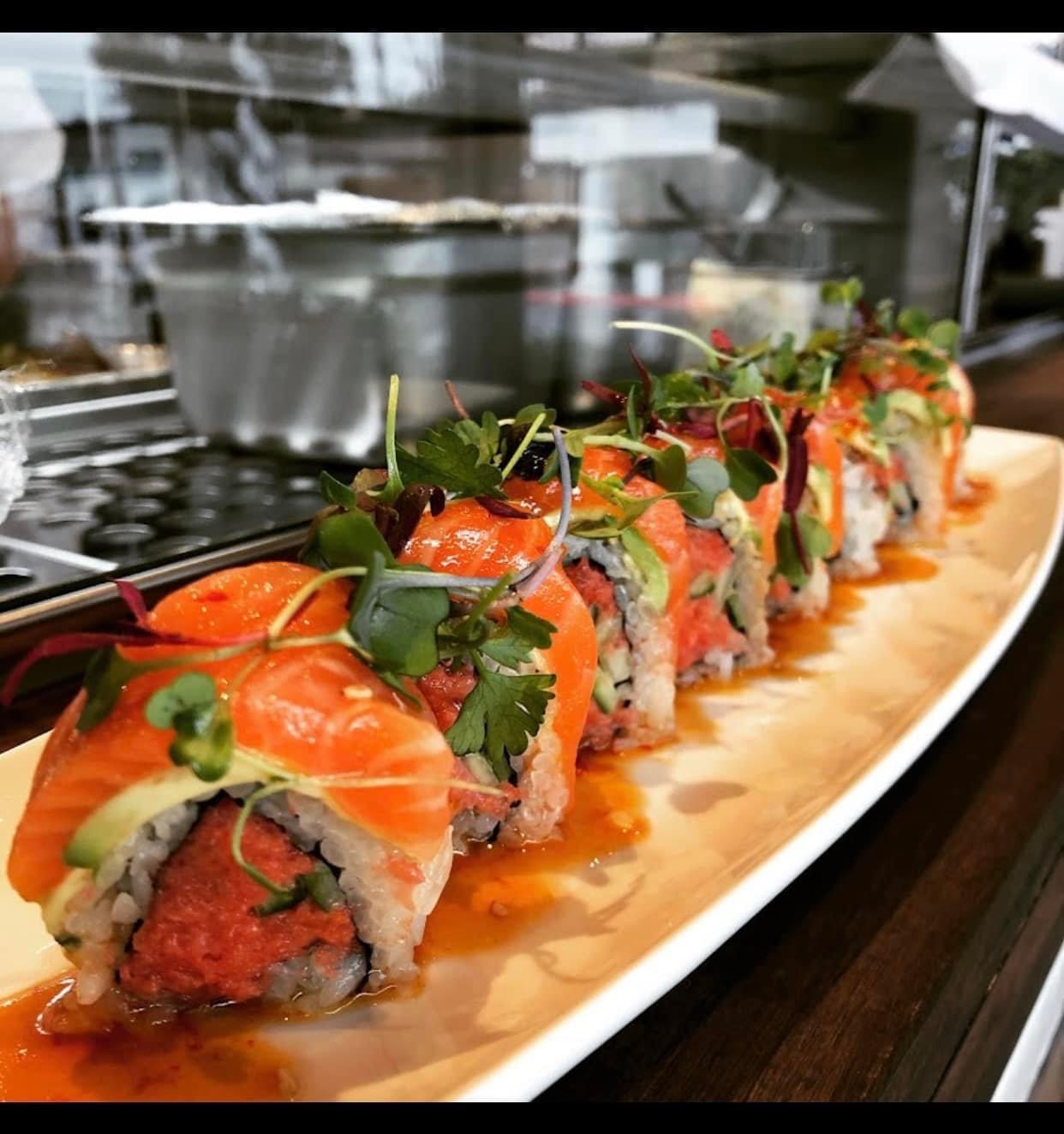 Go Juu Sunset Roll plated with colorful garnishes